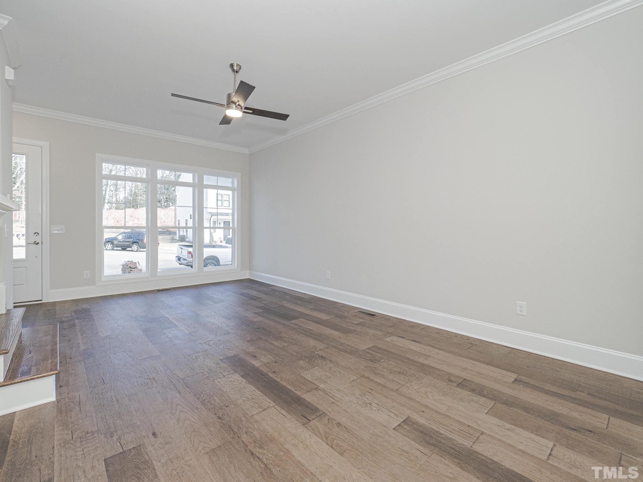 4920 Trek Lane Raleigh, NC 27606 - Photo 28 of 31 wooden floor in an empty room with a window