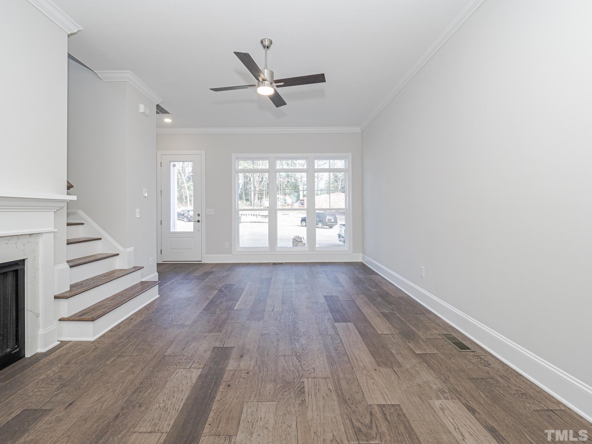 4920 Trek Lane Raleigh, NC 27606 - Photo 8 of 31 wooden floor in an empty room with a window