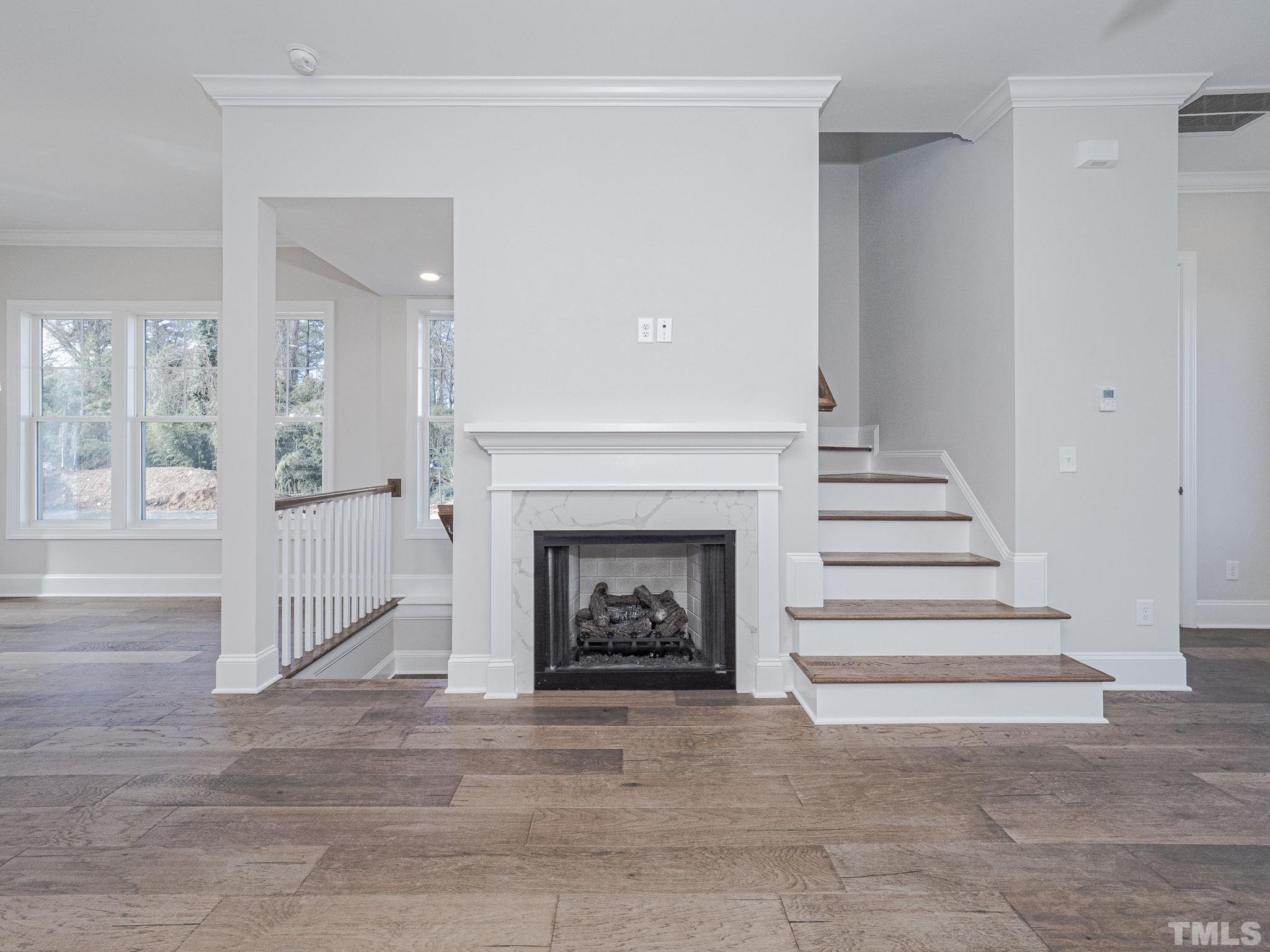 4920 Trek Lane Raleigh, NC 27606 - Photo 9 of 31 a living room with a fireplace