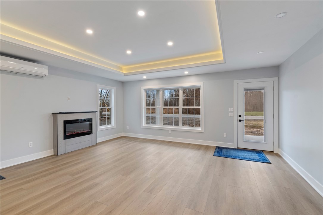 4034 Rasmussen Street Williamson, NY 14589 - Photo 11 of 27 The tray ceiling offers ambient evening lighting