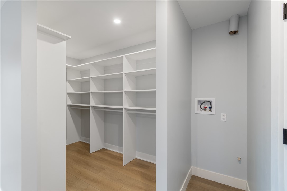 4034 Rasmussen Street Williamson, NY 14589 - Photo 14 of 27 HUGE walk in closet with built in storage - also p