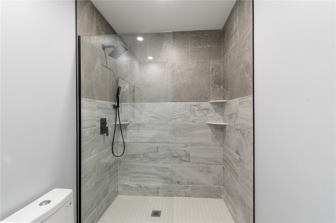 4034 Rasmussen Street Williamson, NY 14589 - Photo 16 of 27 Expert CUSTOM TILE in this full bath