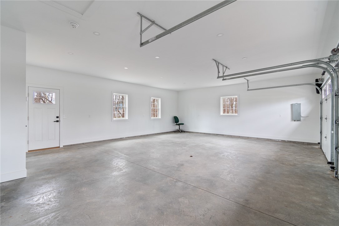4034 Rasmussen Street Williamson, NY 14589 - Photo 22 of 27 The OVERSIZED garage with HEATED FLOORS! You can e
