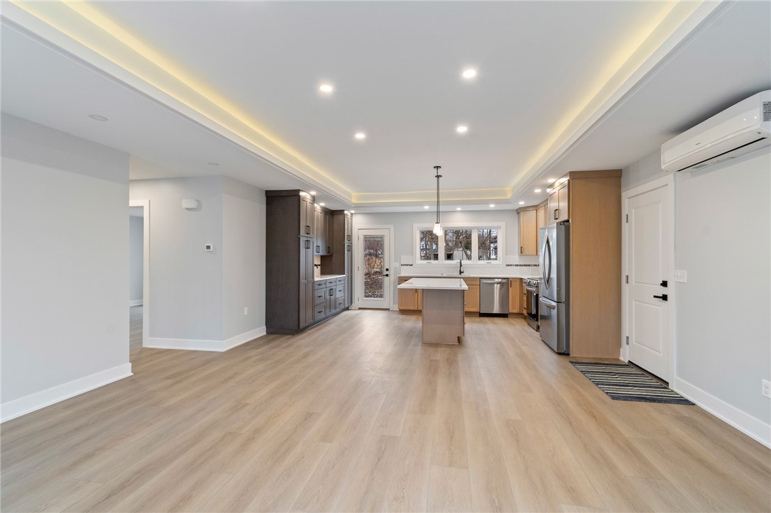 4034 Rasmussen Street Williamson, NY 14589 - Photo 5 of 27 The view to the kitchen - there’s ample QUARTZ cou