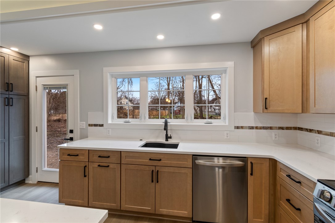 4034 Rasmussen Street Williamson, NY 14589 - Photo 6 of 27 An incredible amount of cupboard space in this hom