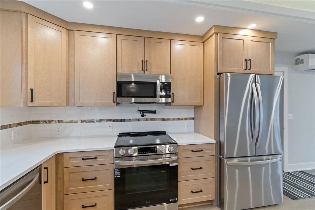 4034 Rasmussen Street Williamson, NY 14589 - Photo 7 of 27 This CUSTOM BUILT kitchen has so many amenities!