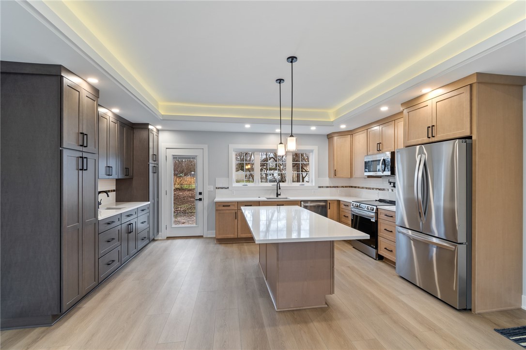 4034 Rasmussen Street Williamson, NY 14589 - Photo 8 of 27 The kitchen in this RANCH STYLE HOME!