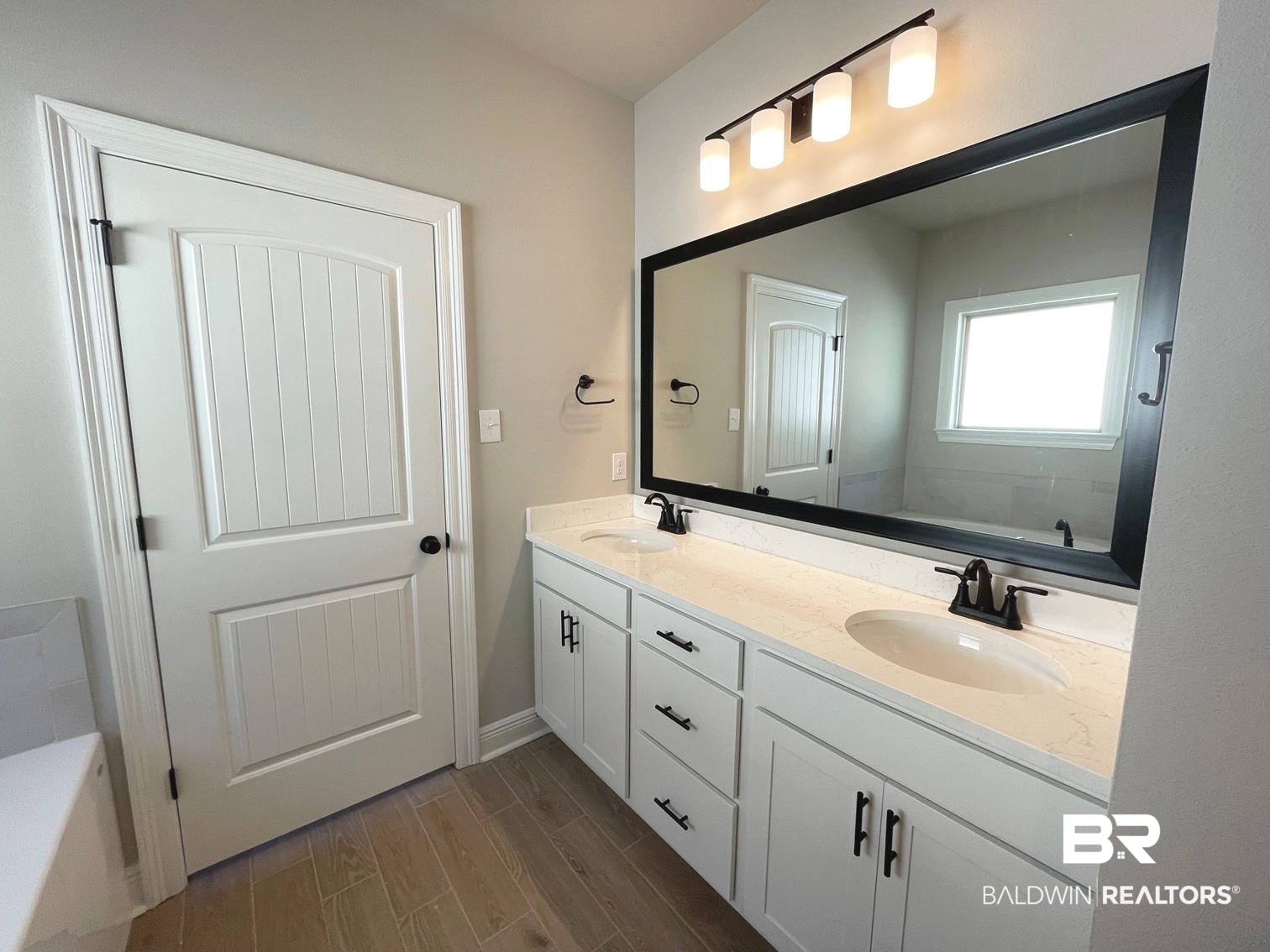 1579 Fenton Circle Foley, AL 36535 - Photo 6 of 14 Bathroom with hardwood / wood-style flooring, vanity, and a bathing tub