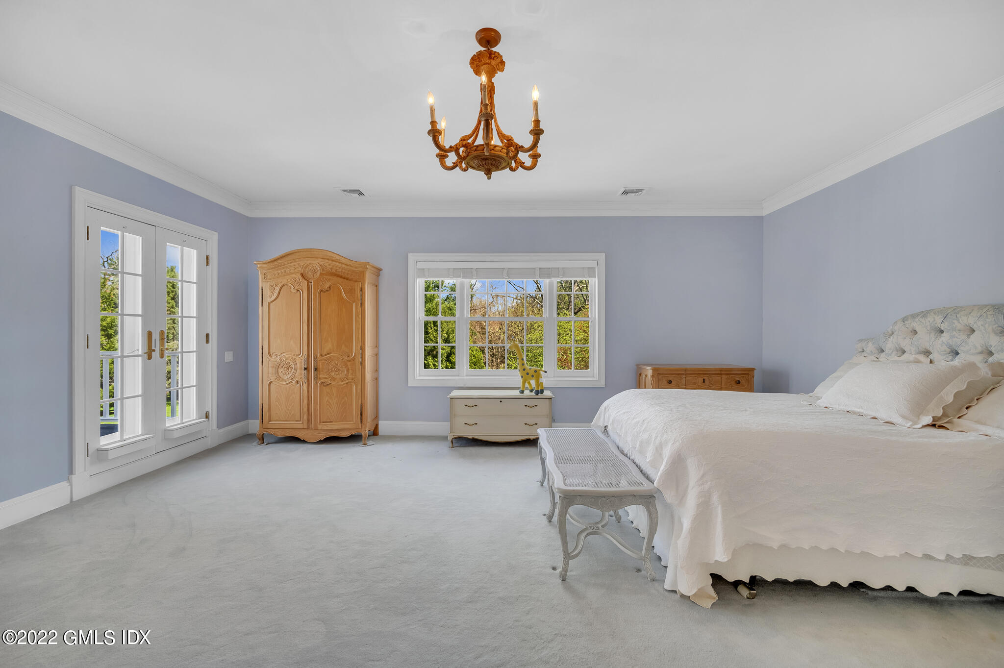 280 Round Hill Road Greenwich, CT 06831 - Photo 18 of 35 a bedroom with a bed and a window