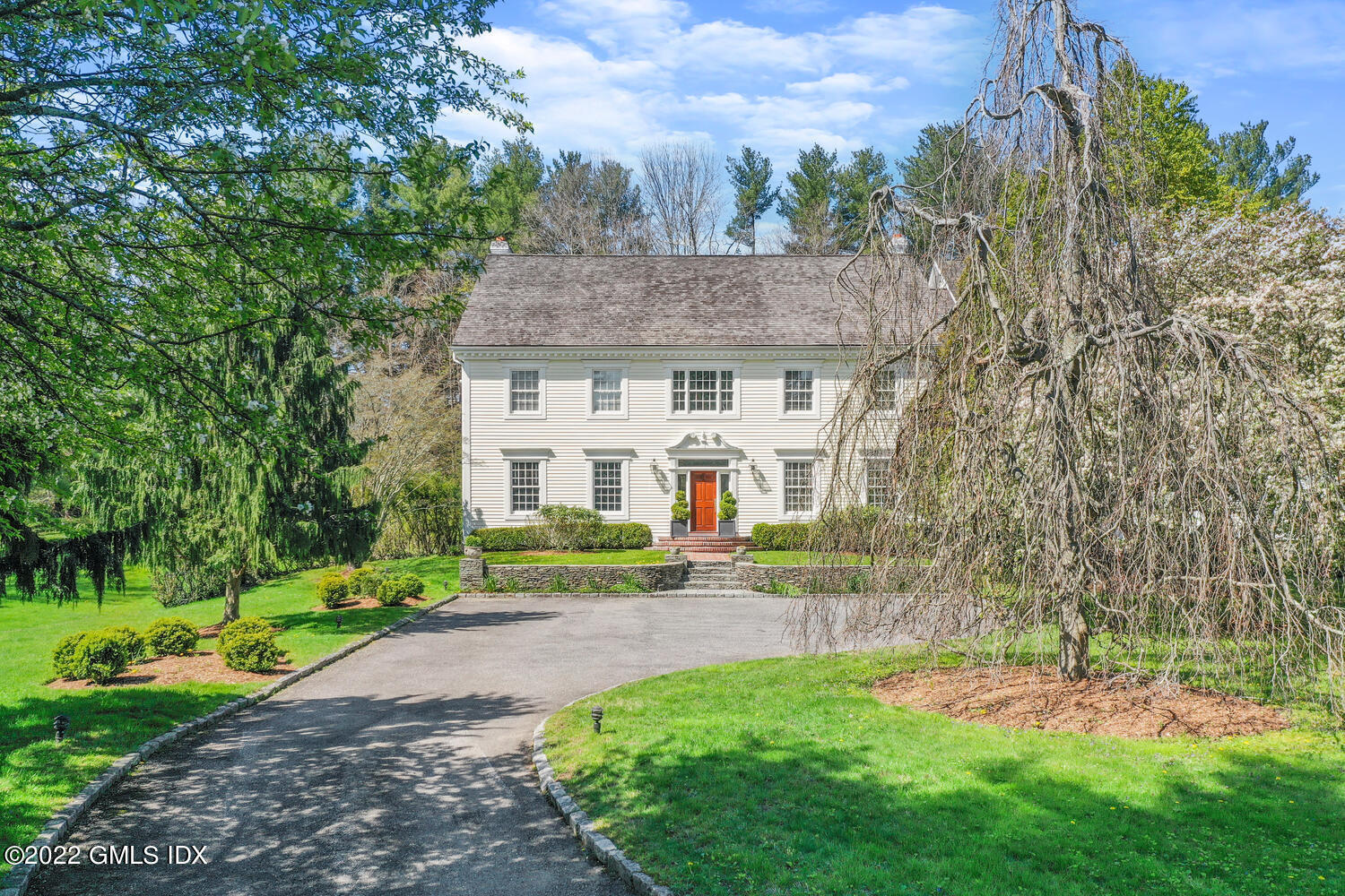 280 Round Hill Road Greenwich, CT 06831 - Photo 2 of 35 a front view of a house with garden