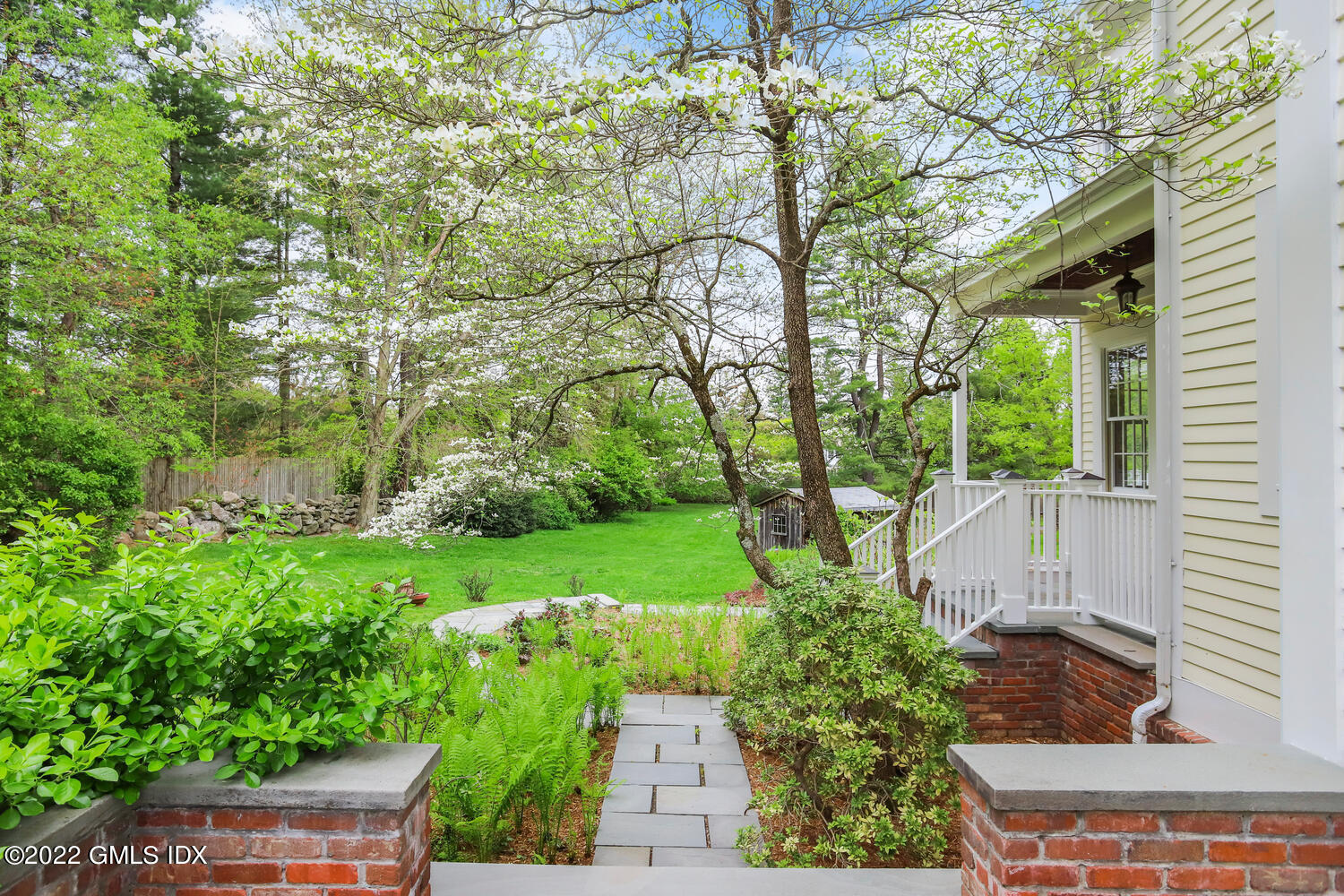 280 Round Hill Road Greenwich, CT 06831 - Photo 24 of 35 a view of a garden with plants and large trees