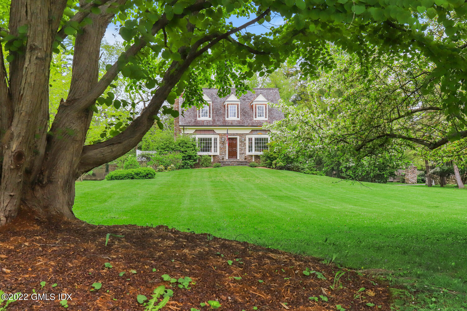 280 Round Hill Road Greenwich, CT 06831 - Photo 3 of 35 a front view of a house with a yard