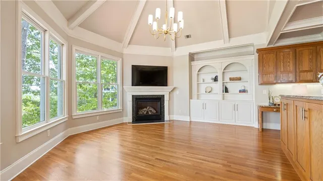 a kitchen with stainless steel appliances granite countertop a sink and cabinets