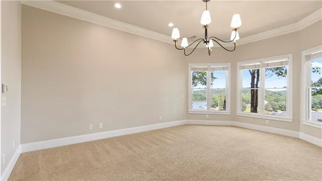 a bathroom with a granite countertop sink and a toilet
