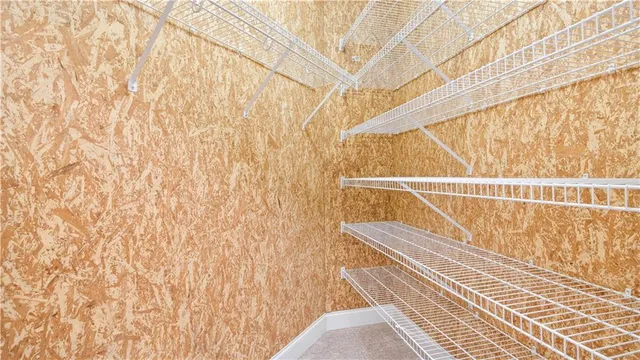 a room with pool table and windows