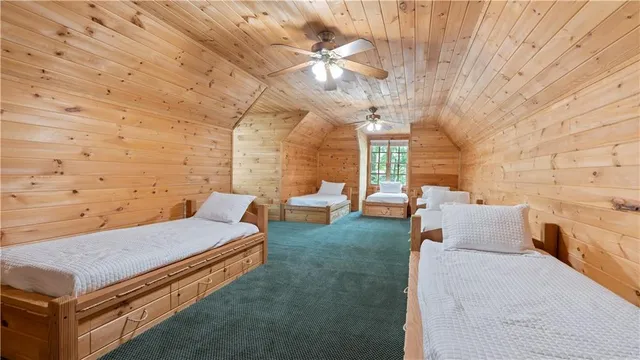 a view of a backyard with sitting area