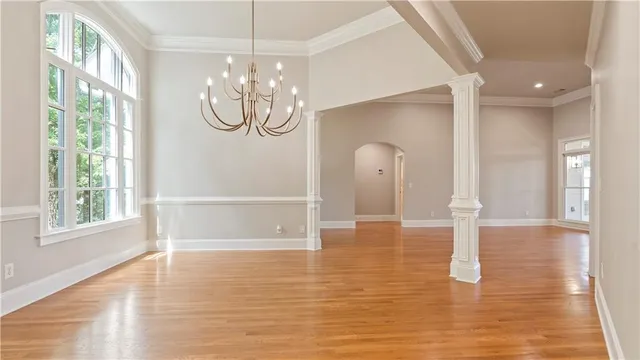 a view of a livingroom with an empty space and a fireplace