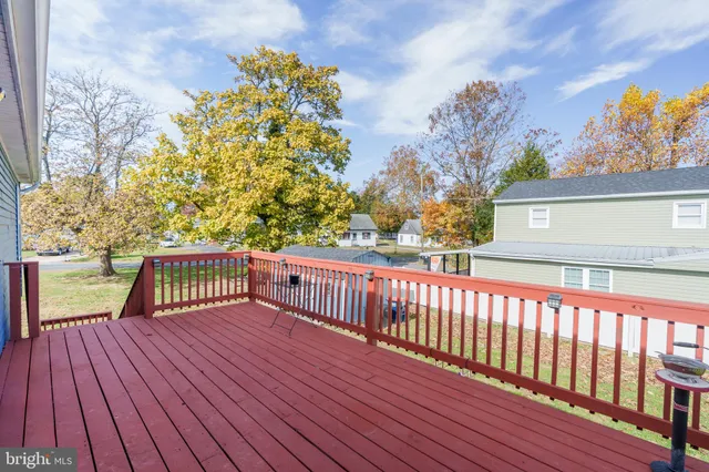 a view of balcony with wooden floor