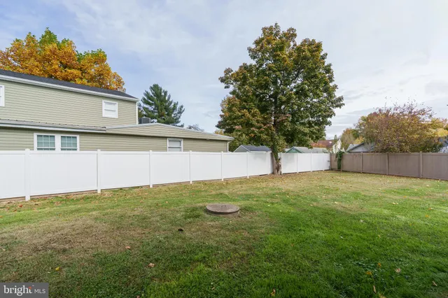 a view of a backyard of the house