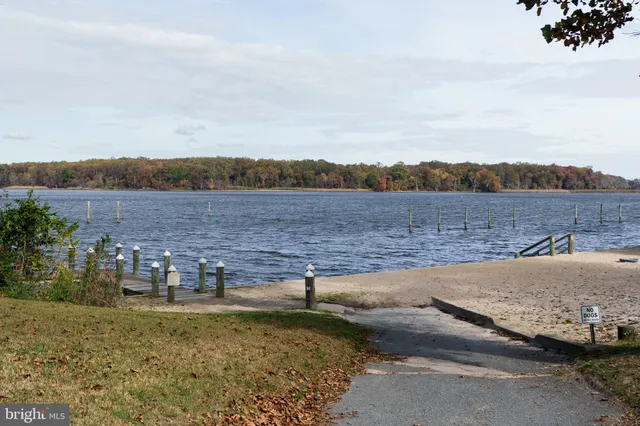 a view of a lake with houses in the back