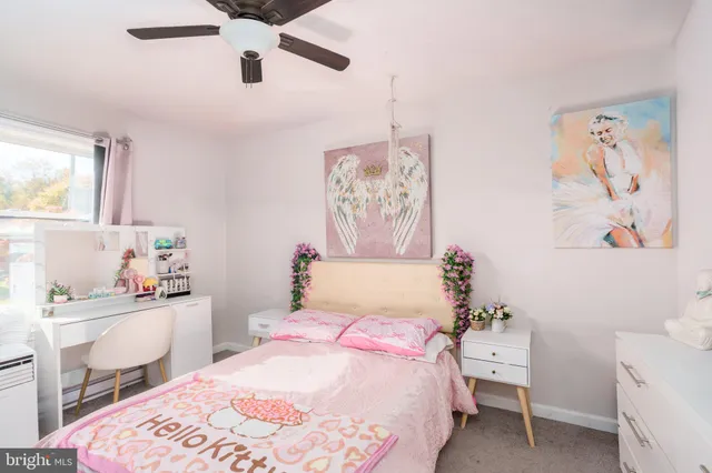 a bedroom with a bed and a table in it