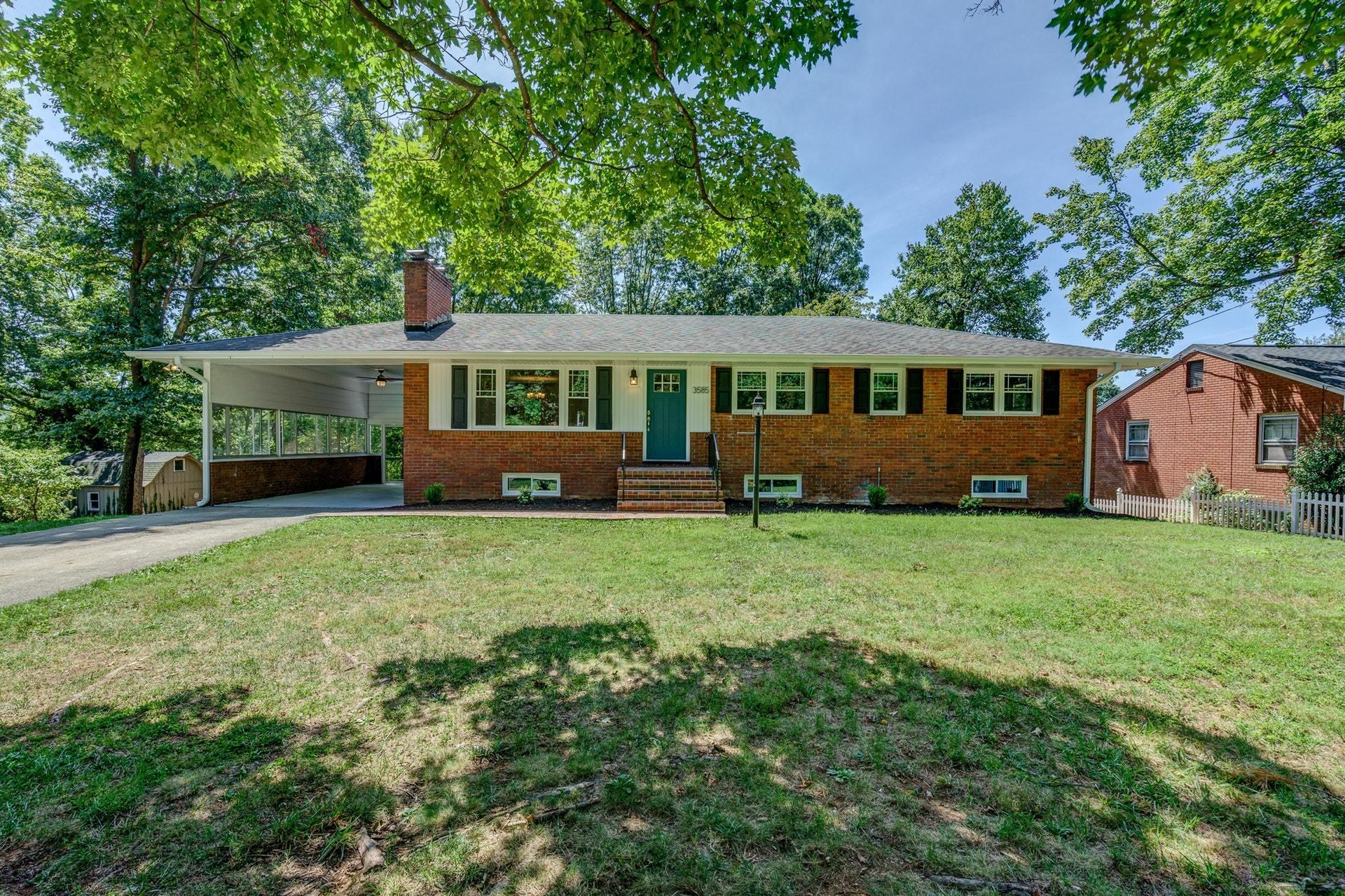 3585 Forester Road Southwest Roanoke, VA 24018 - Photo 1 of 38 a front view of a house with a garden