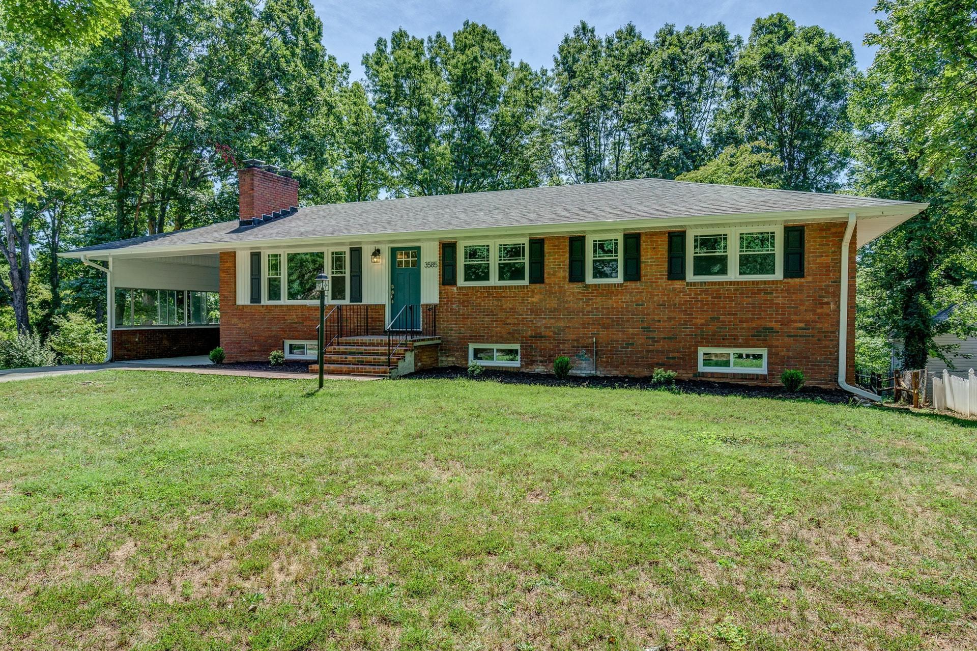 3585 Forester Road Southwest Roanoke, VA 24018 - Photo 2 of 38 a front view of a house with a garden