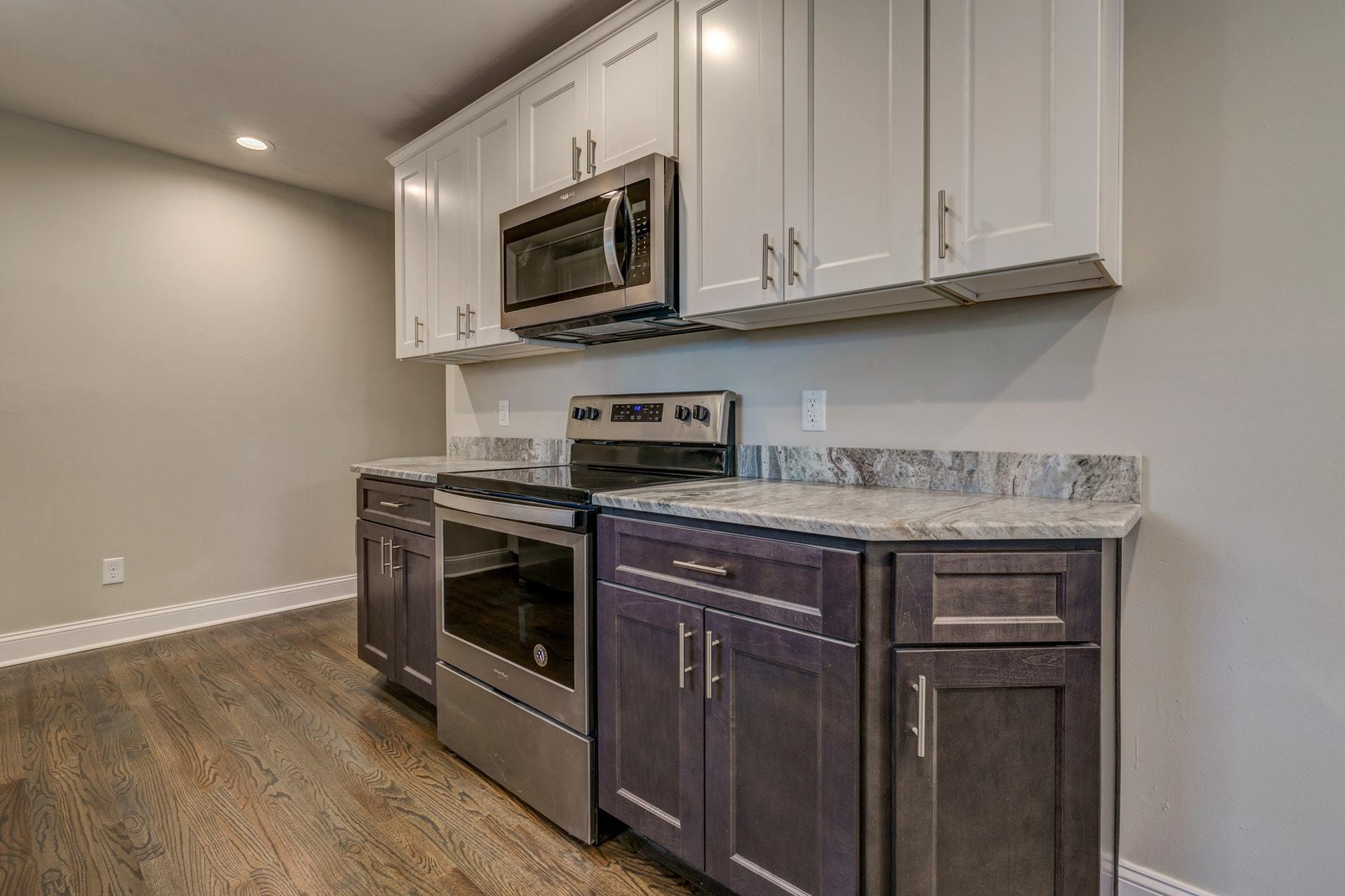 3585 Forester Road Southwest Roanoke, VA 24018 - Photo 13 of 38 a kitchen with stainless steel appliances granite countertop a stove and a microwave
