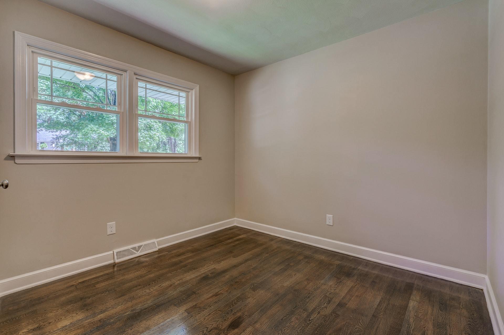 3585 Forester Road Southwest Roanoke, VA 24018 - Photo 16 of 38 an empty room with wooden floor and windows