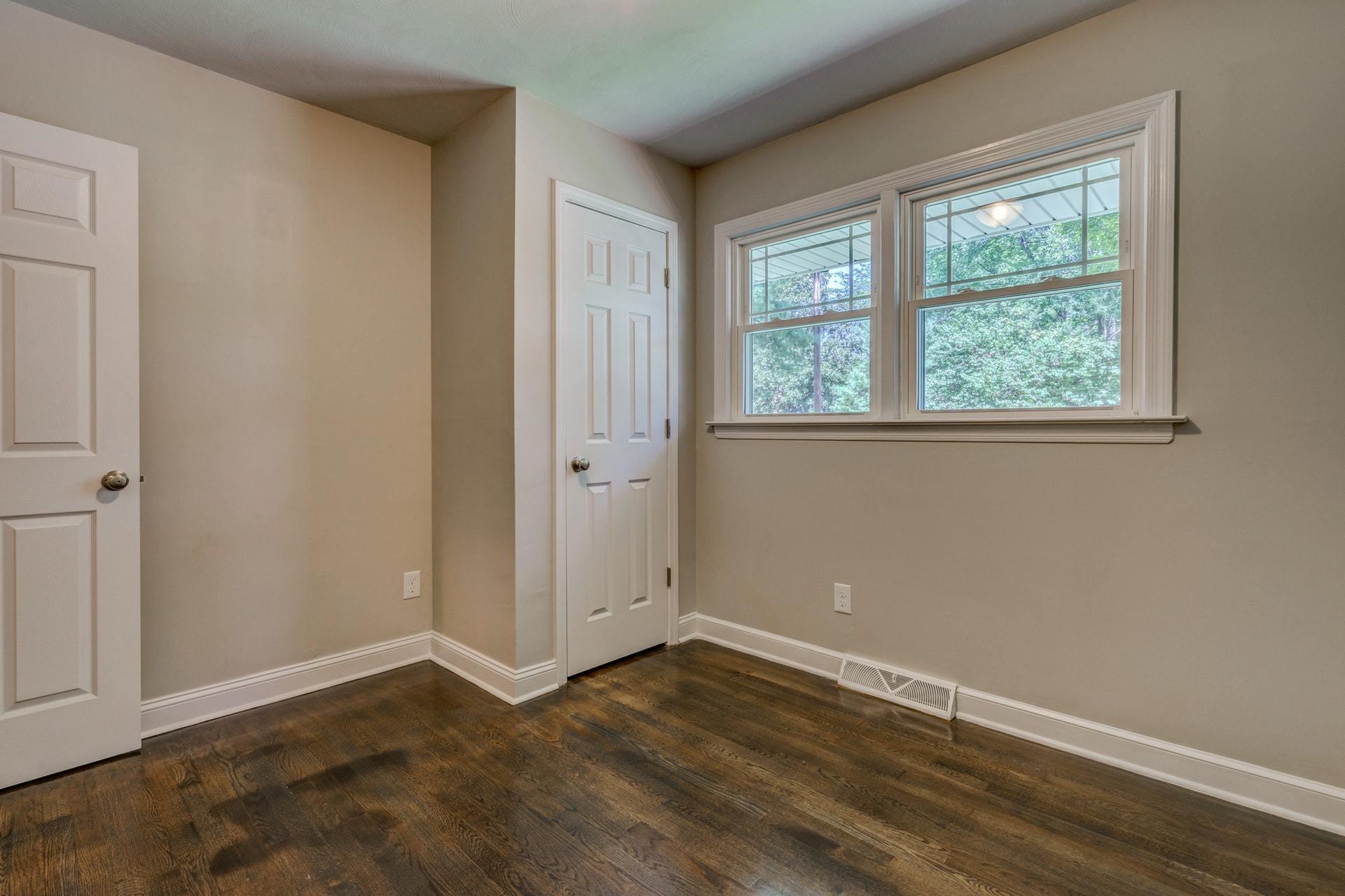 3585 Forester Road Southwest Roanoke, VA 24018 - Photo 17 of 38 an empty room with wooden floor and windows