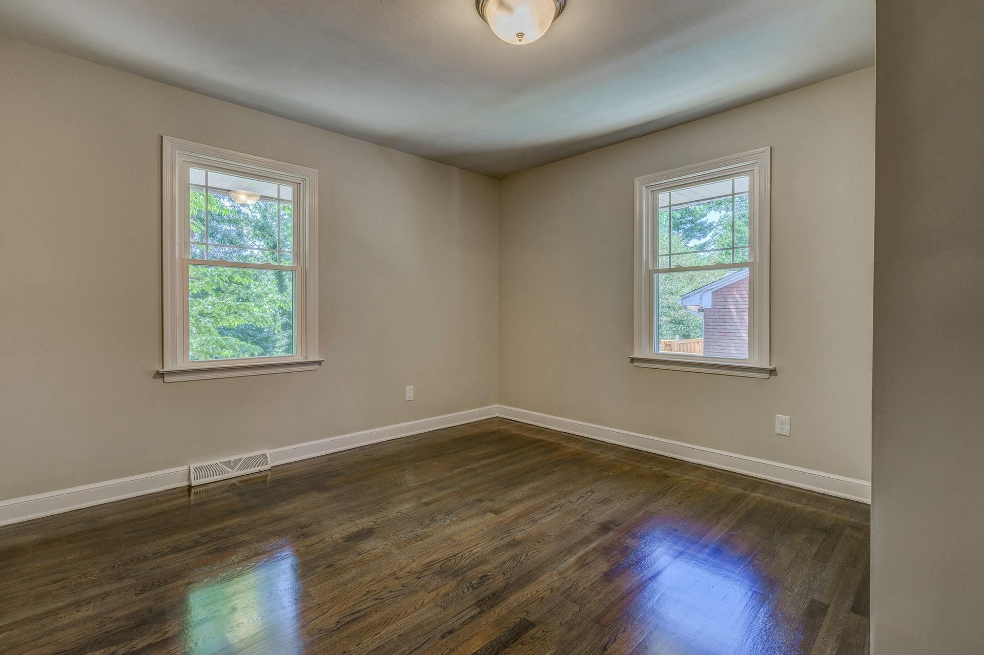 3585 Forester Road Southwest Roanoke, VA 24018 - Photo 19 of 38 a view of an empty room with wooden floor and a window