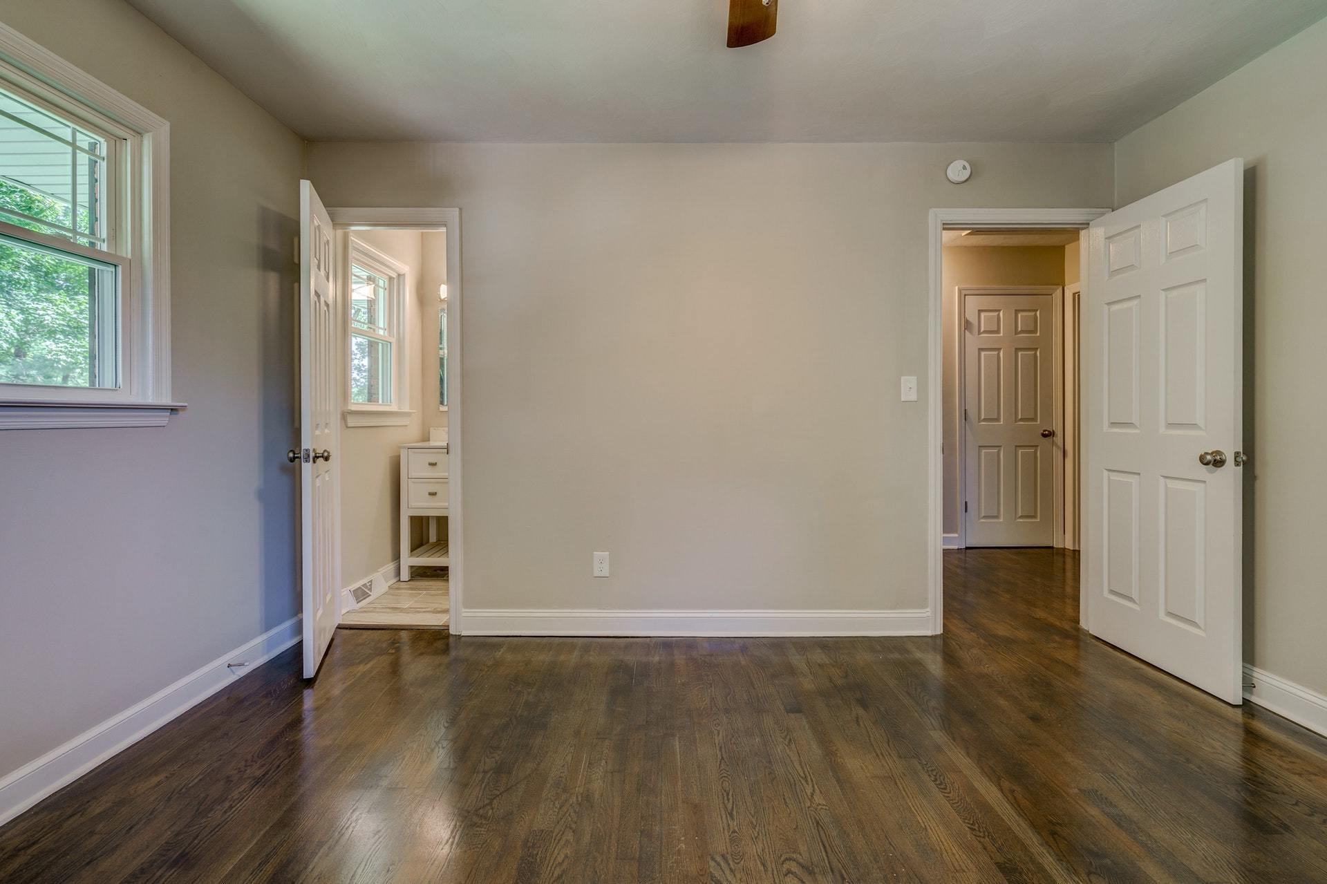 3585 Forester Road Southwest Roanoke, VA 24018 - Photo 20 of 38 an empty room with wooden floor and windows
