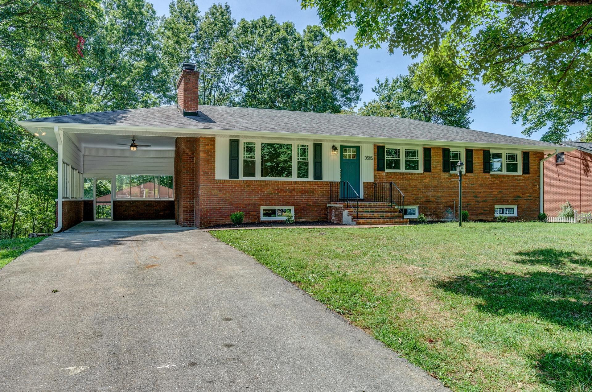3585 Forester Road Southwest Roanoke, VA 24018 - Photo 3 of 38 a front view of a house with a garden