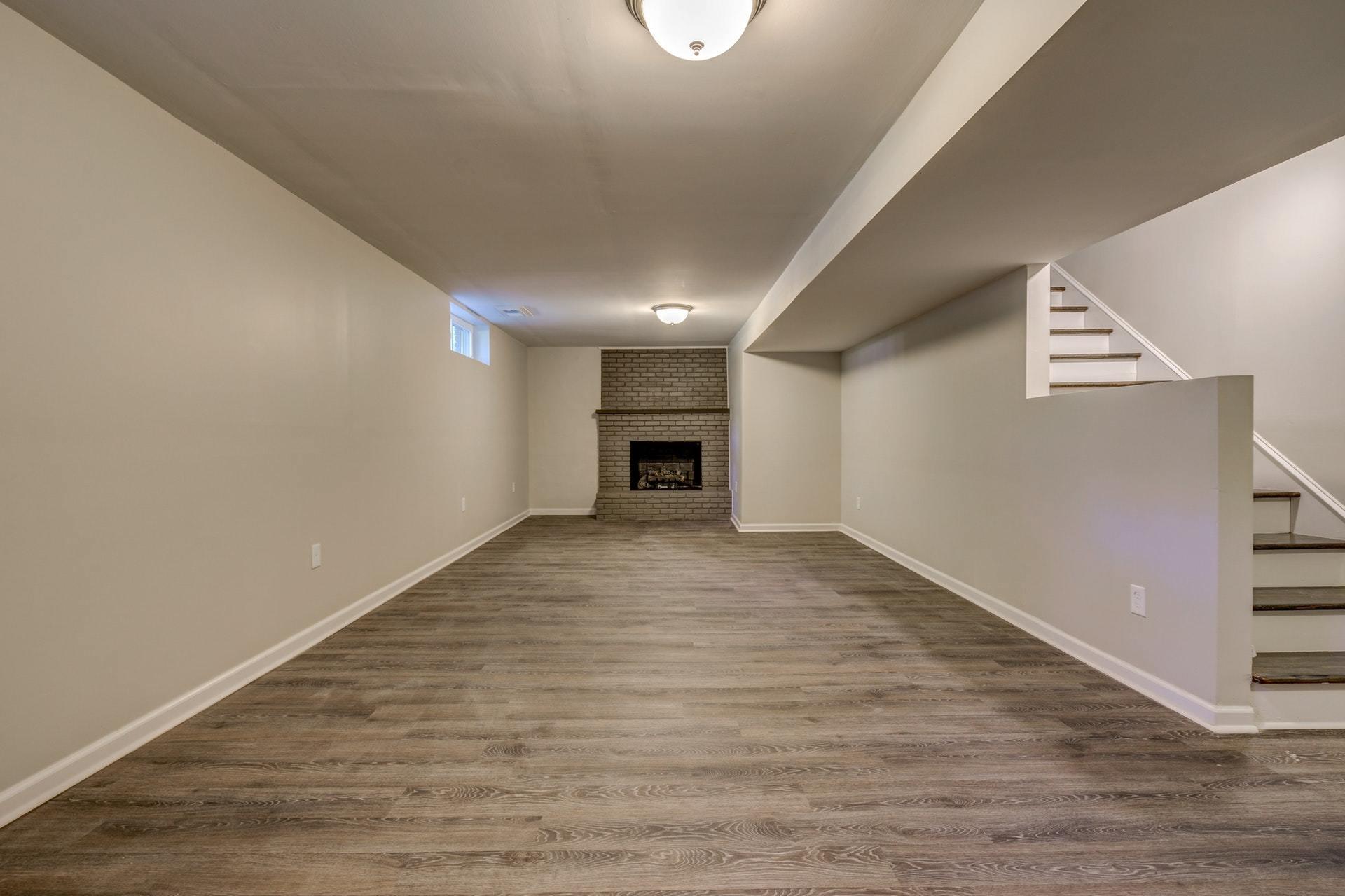 3585 Forester Road Southwest Roanoke, VA 24018 - Photo 23 of 38 a view of empty room with wooden floor and fireplace
