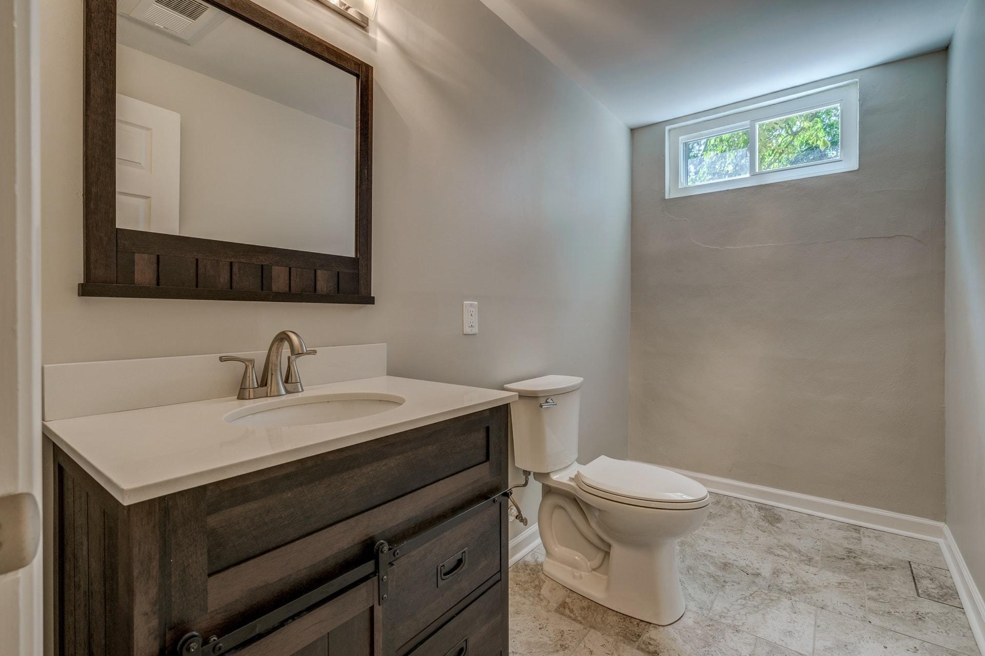 3585 Forester Road Southwest Roanoke, VA 24018 - Photo 25 of 38 a bathroom with a toilet a sink and mirror