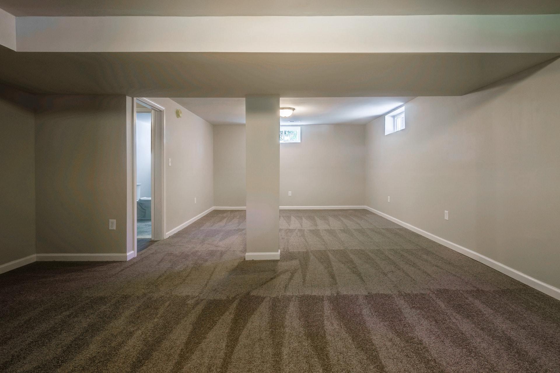 3585 Forester Road Southwest Roanoke, VA 24018 - Photo 27 of 38 an empty room with wooden floor and windows
