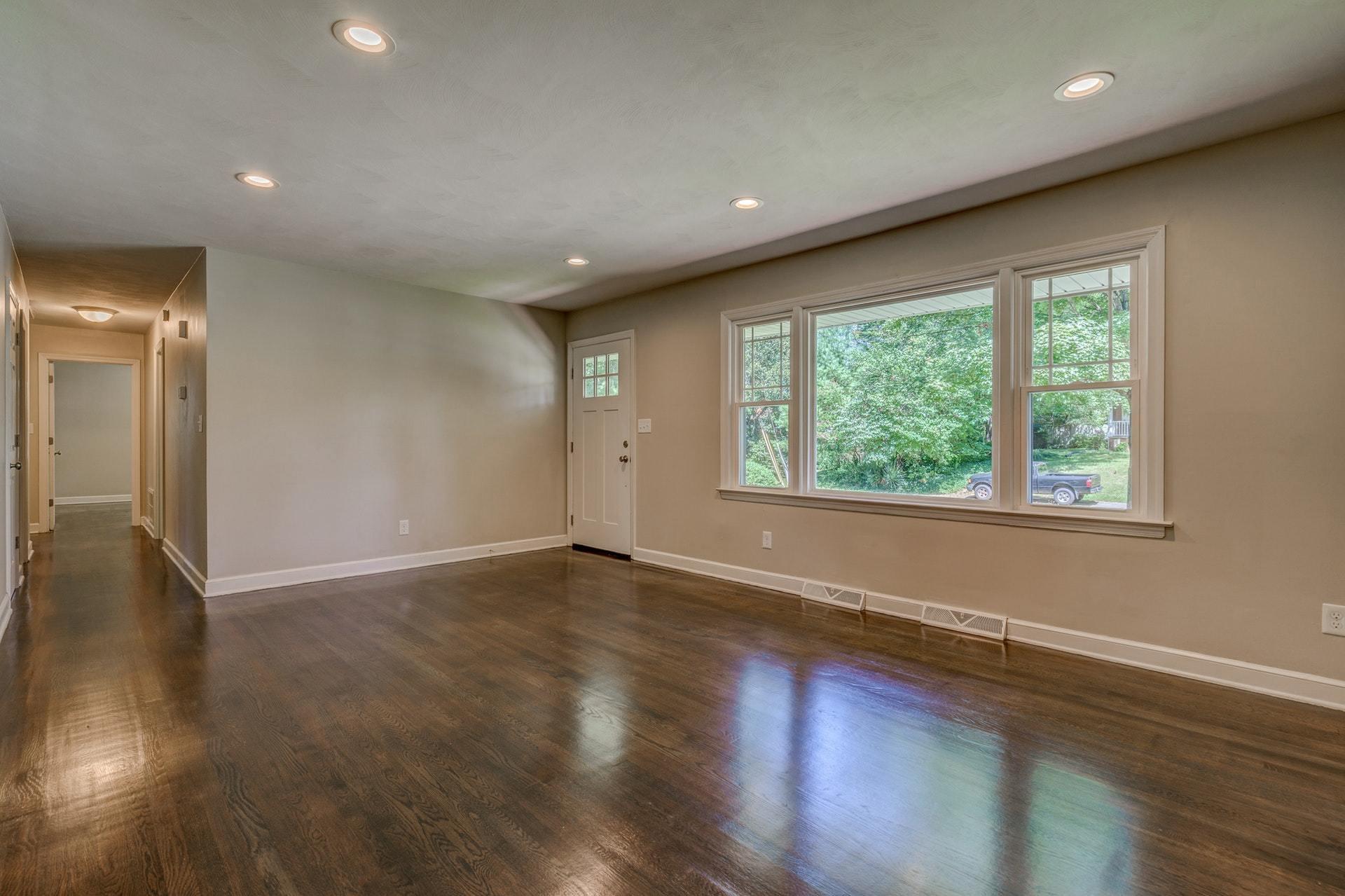 3585 Forester Road Southwest Roanoke, VA 24018 - Photo 5 of 38 an empty room with wooden floor and windows
