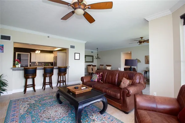 a living room with furniture and a rug