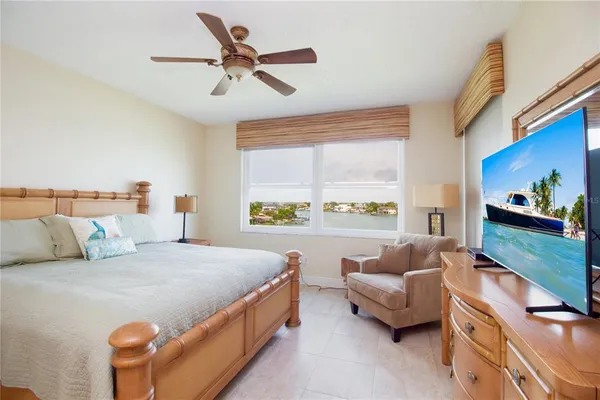 a bedroom with a bed and a couch