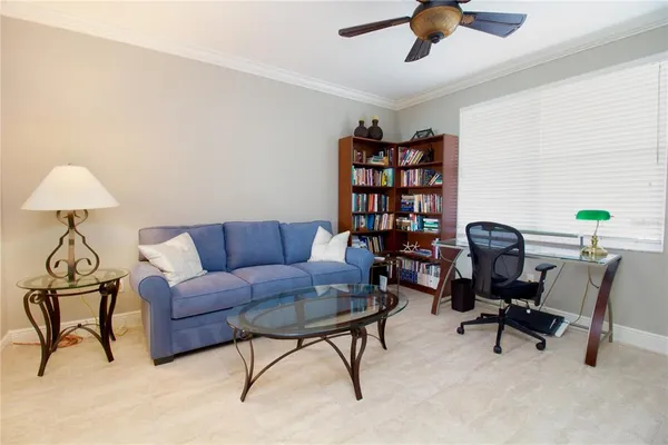 a living room with furniture and a window