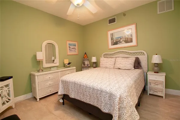 a bedroom with a bed and a dresser
