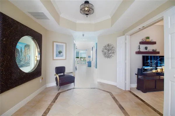 a living room with furniture and a clock