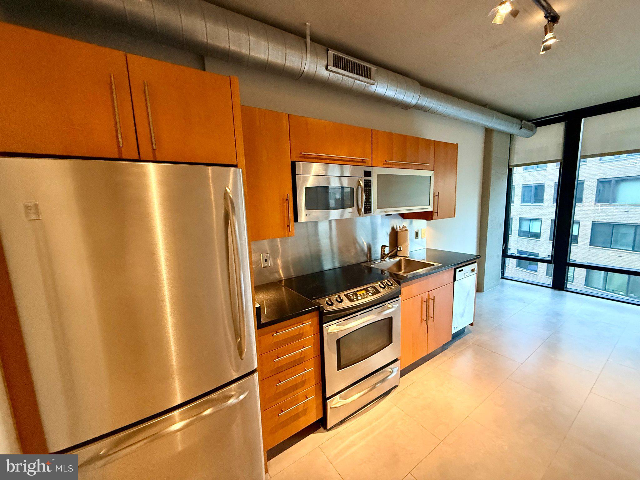 1133 14th Street Northwest, Unit 503 Washington, DC 20005 - Photo 4 of 29 Sleek urban kitchen with modern finishes.