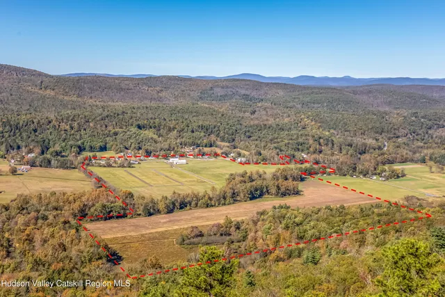 a view of an aerial view of residential houses with outdoor space