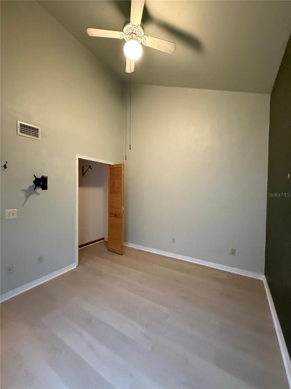 7200 Southwest 8th Avenue, Unit T128 Gainesville, FL 32607 - Photo 16 of 38 an empty room with a empty space and a ceiling fan