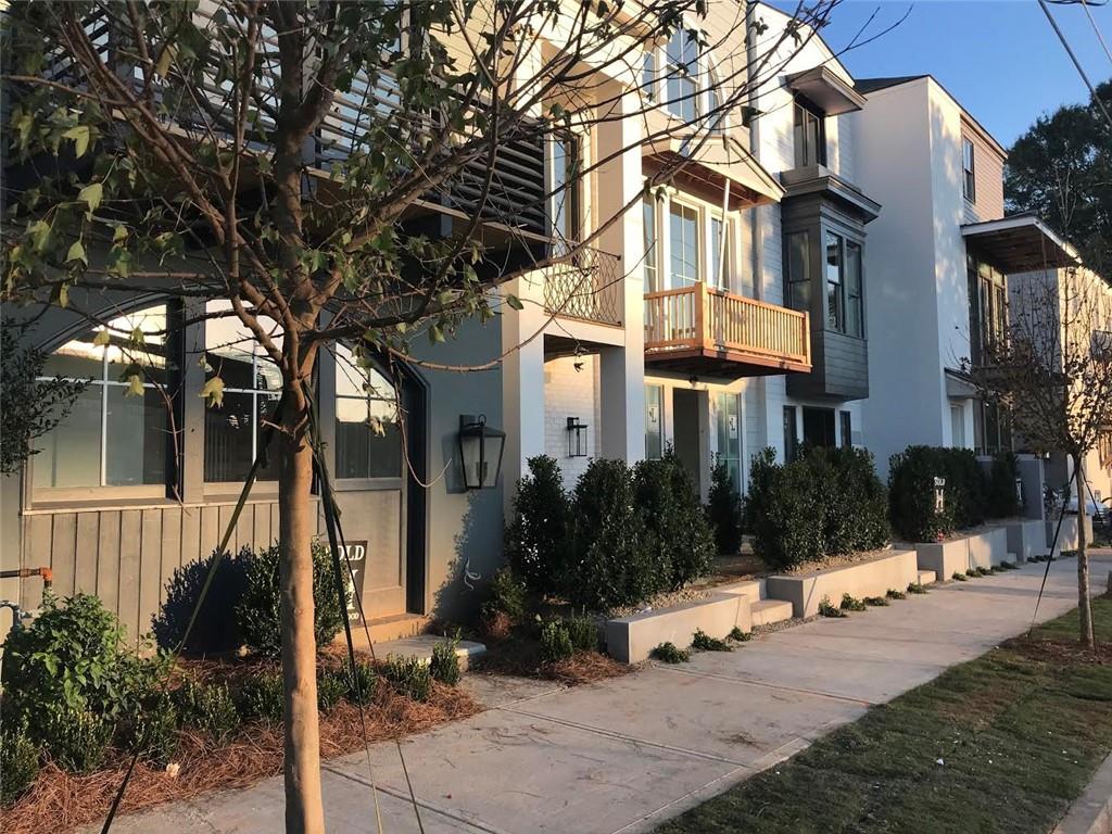 685 Reed Street Southeast, Unit 92 Atlanta, GA 30315 - Photo 1 of 1 a view of a building with a tree in front of it