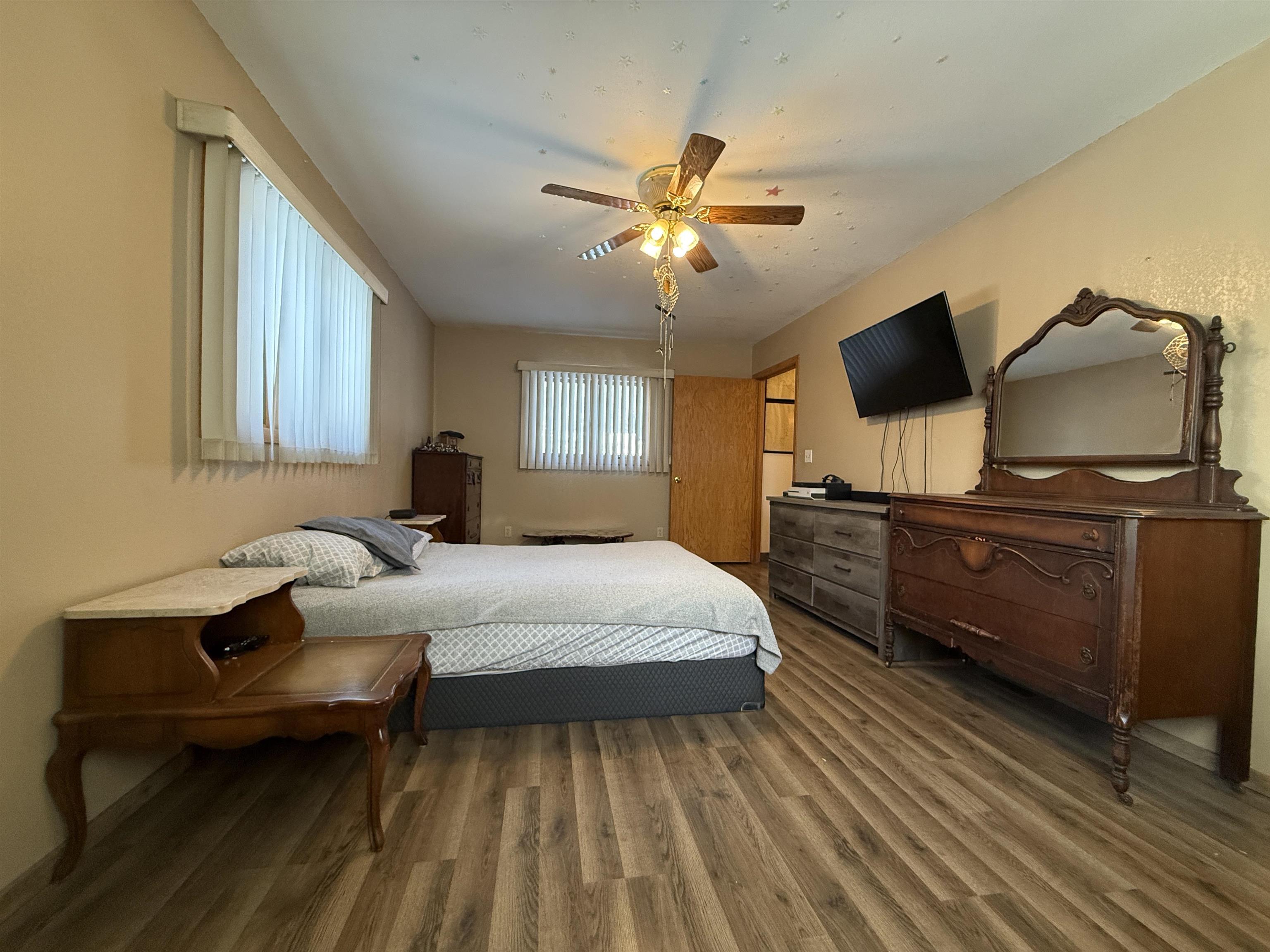609 8th Street Northwest Chisholm, MN 55719 - Photo 16 of 26 Bedroom featuring wood finished floors and ceiling fan