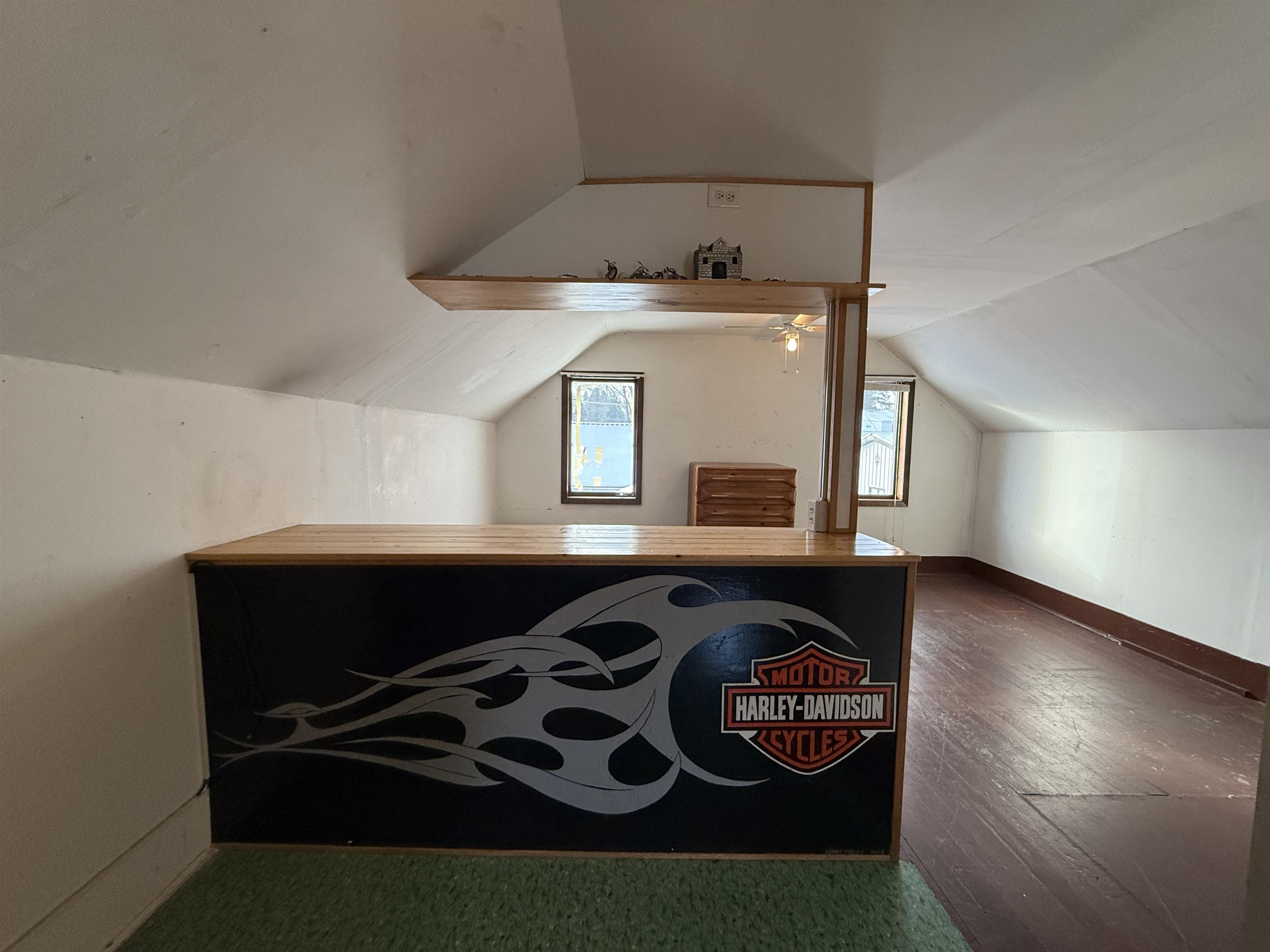 609 8th Street Northwest Chisholm, MN 55719 - Photo 21 of 26 Bonus room featuring vaulted ceiling and dark wood-style flooring