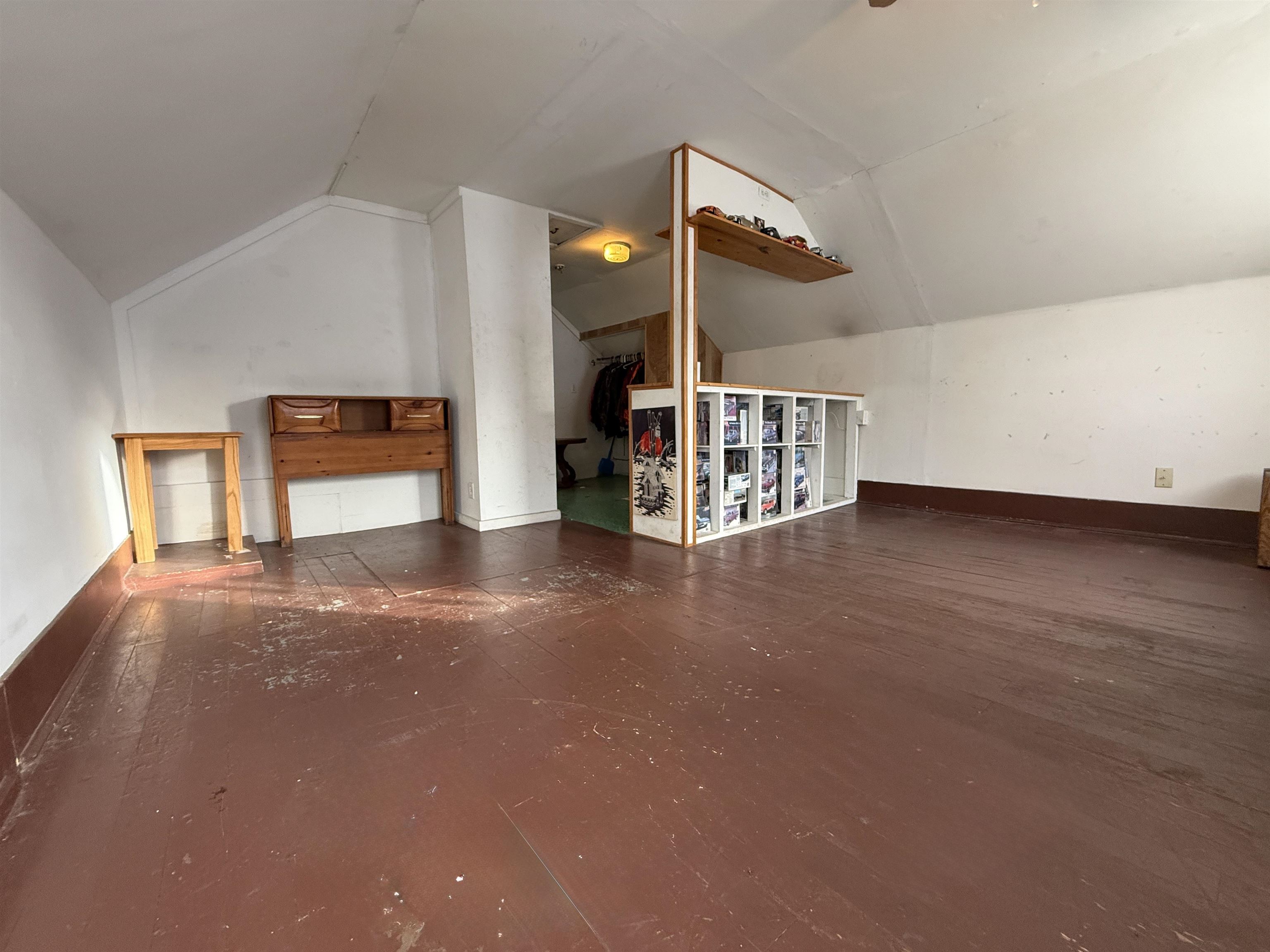 609 8th Street Northwest Chisholm, MN 55719 - Photo 23 of 26 Bonus room with vaulted ceiling and baseboards
