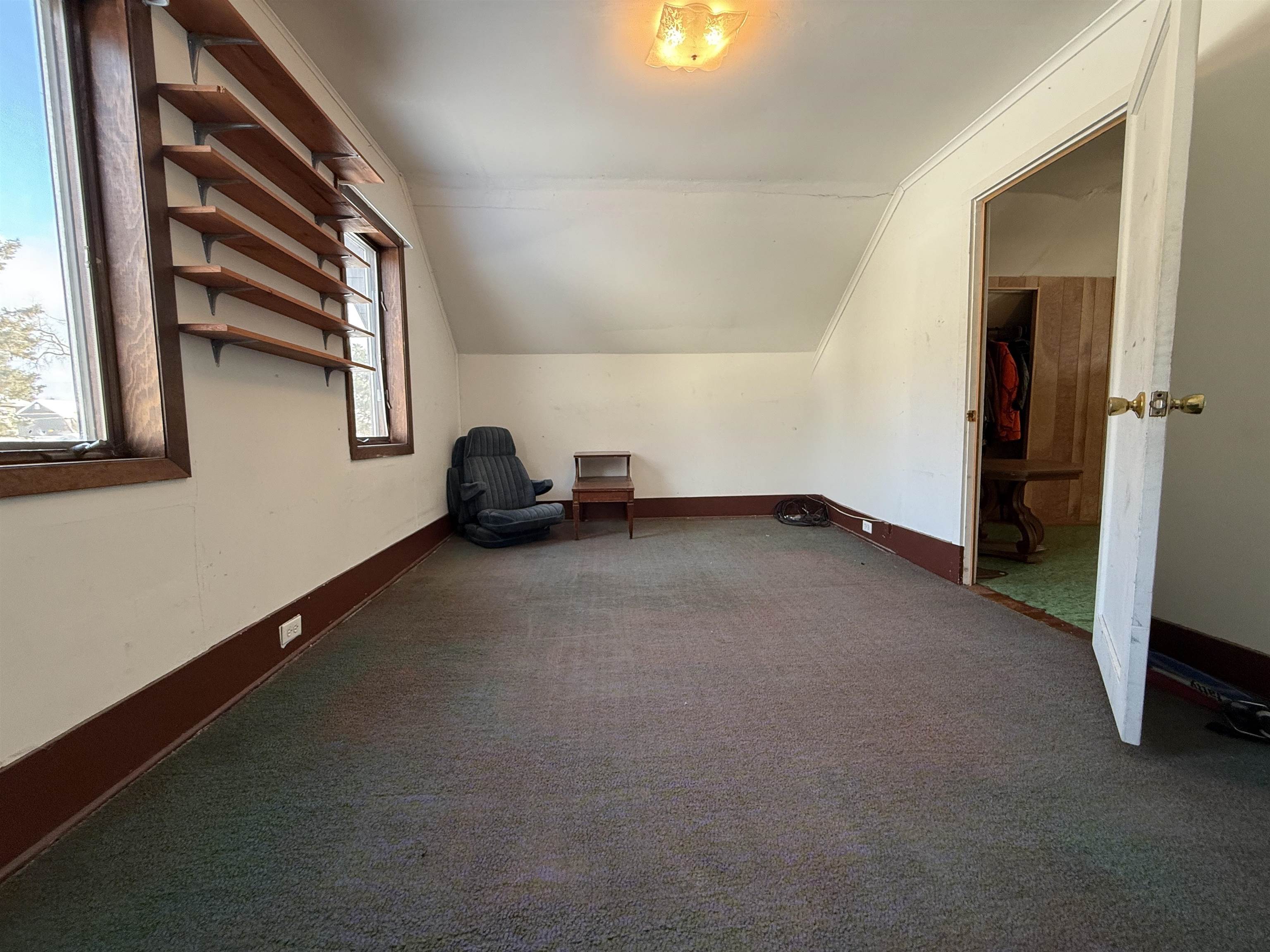 609 8th Street Northwest Chisholm, MN 55719 - Photo 25 of 26 Bonus room featuring carpet and lofted ceiling